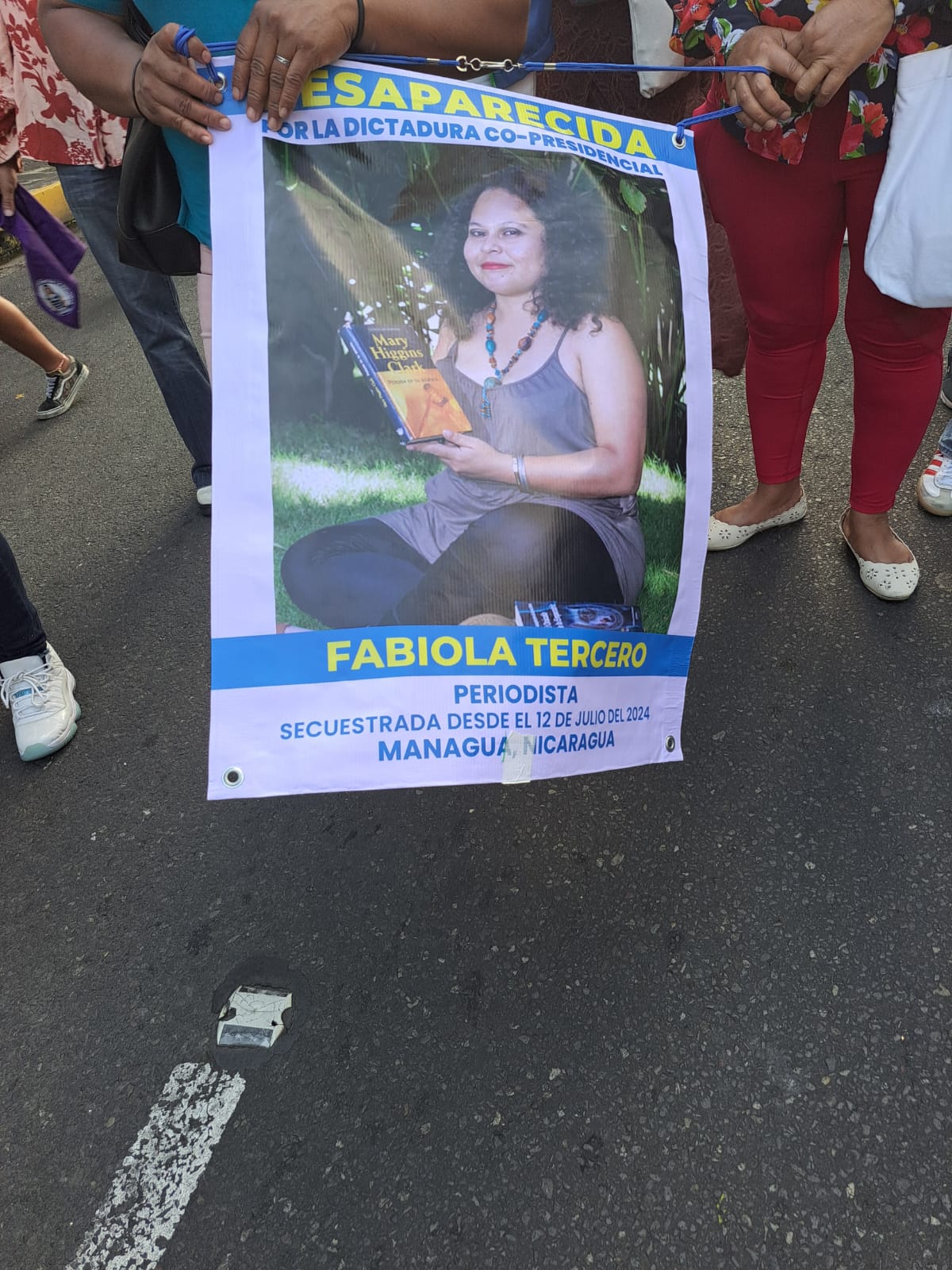 Cartel en la marcha denunciando la desaparicion de la activista Fabiola Tercero